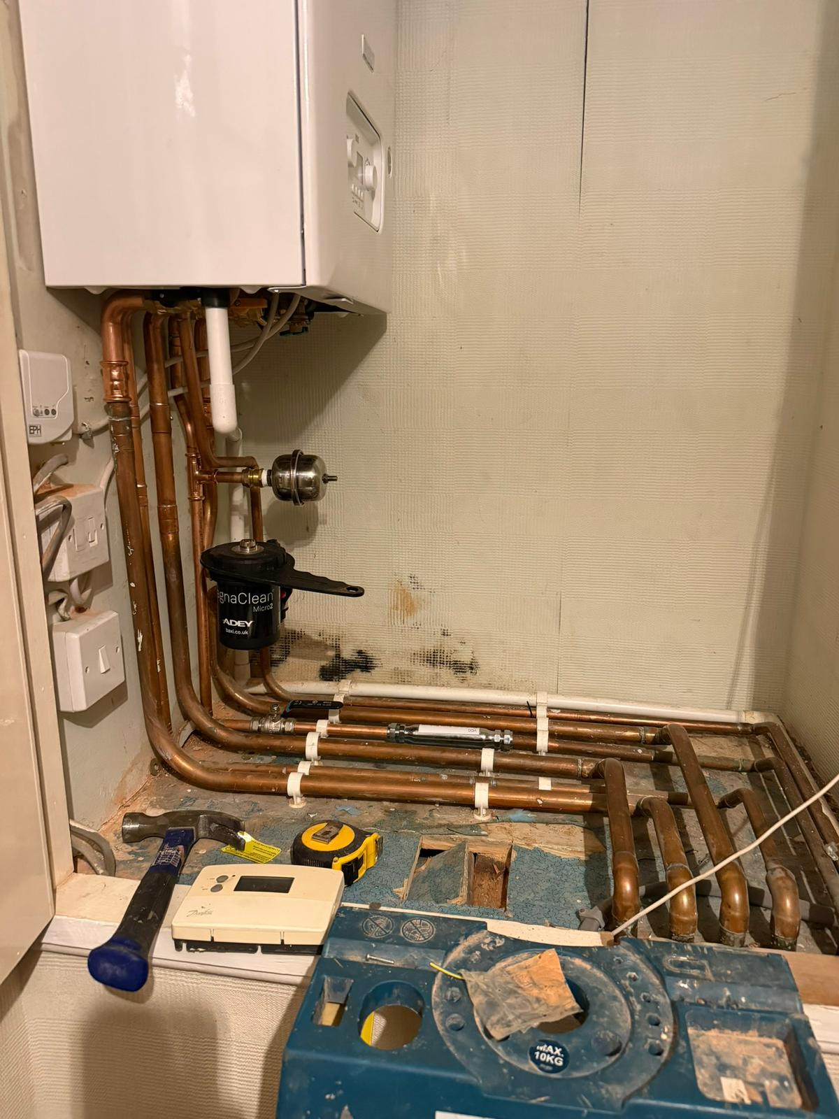 Boiler installation pipework with ADEY MagnaClean magnetic filter and new copper heating pipes, Coventry