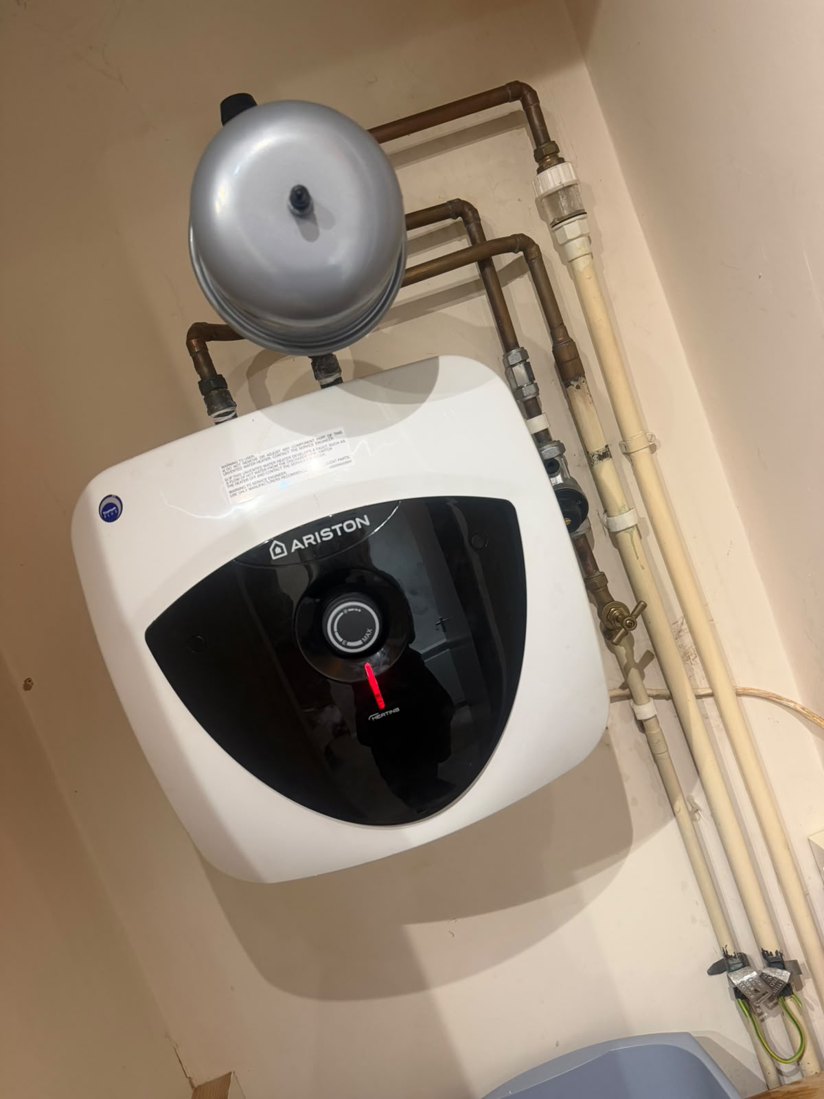 Ariston under-sink unvented water heater with expansion vessel and copper pipework