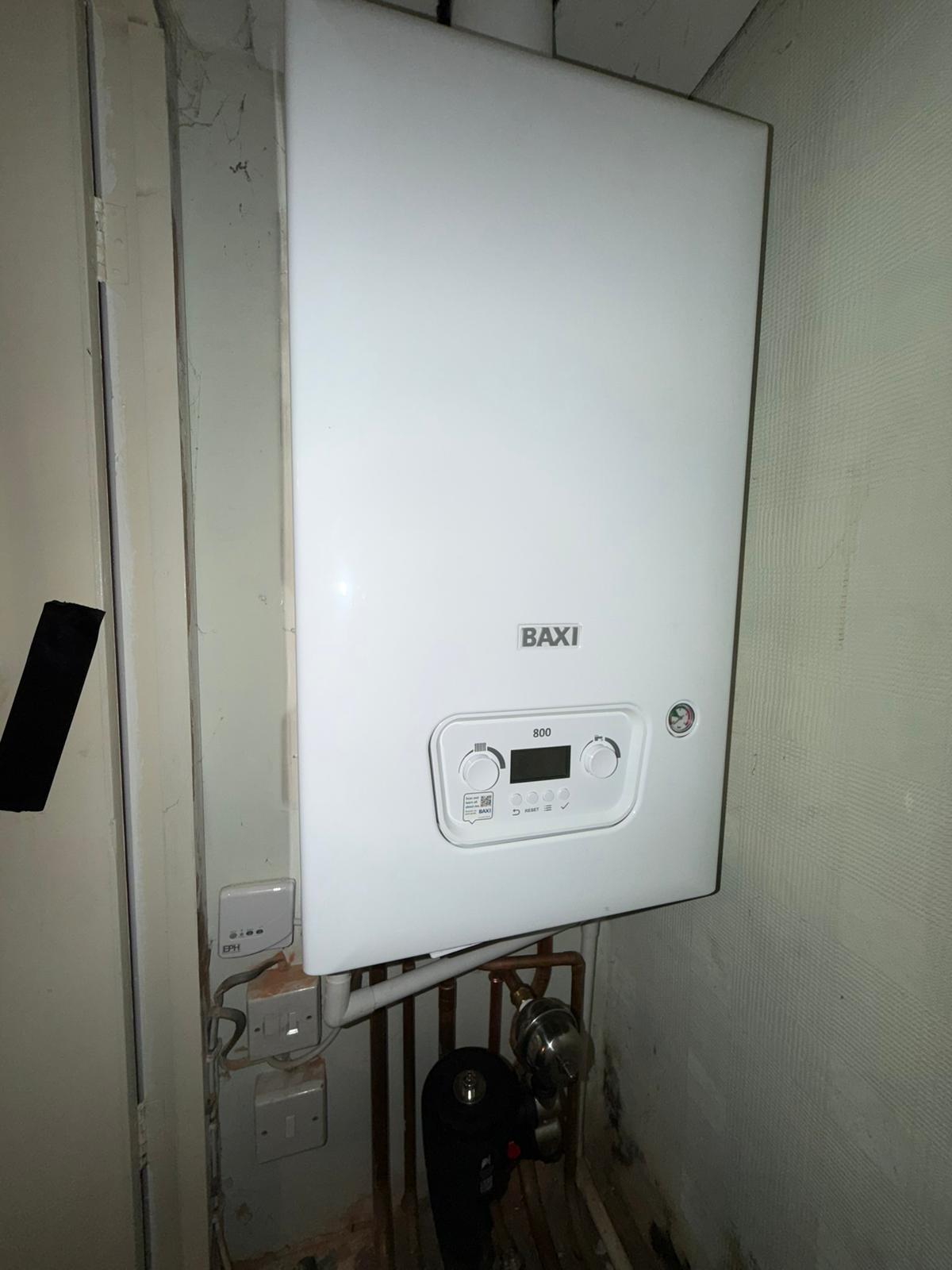 New Baxi 800 combi boiler installed in airing cupboard with copper pipework, Coventry